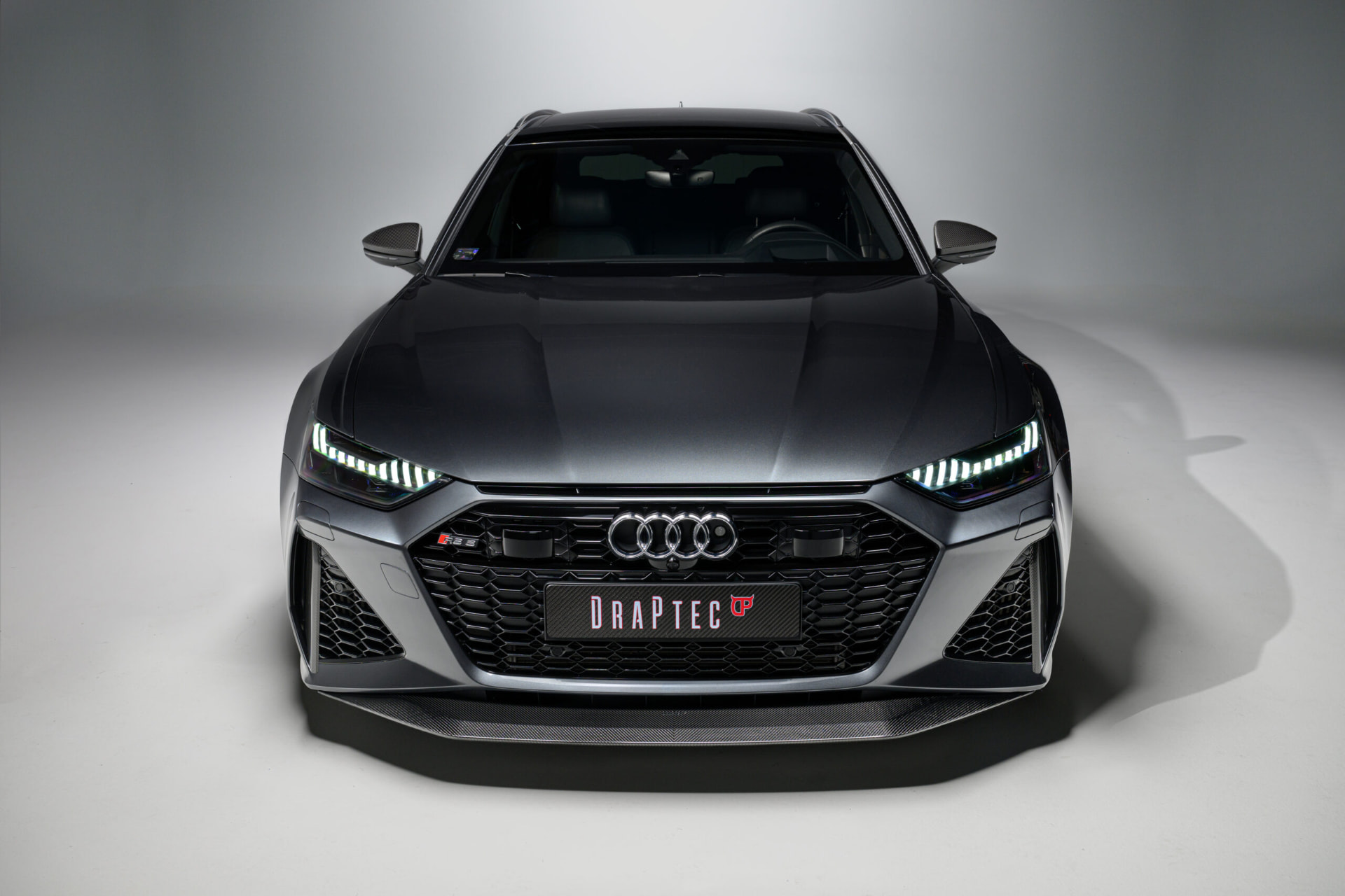 Grey Audi RS6 fitted with a DRAPTEC carbon fibre front splitter, front three-quarter view
