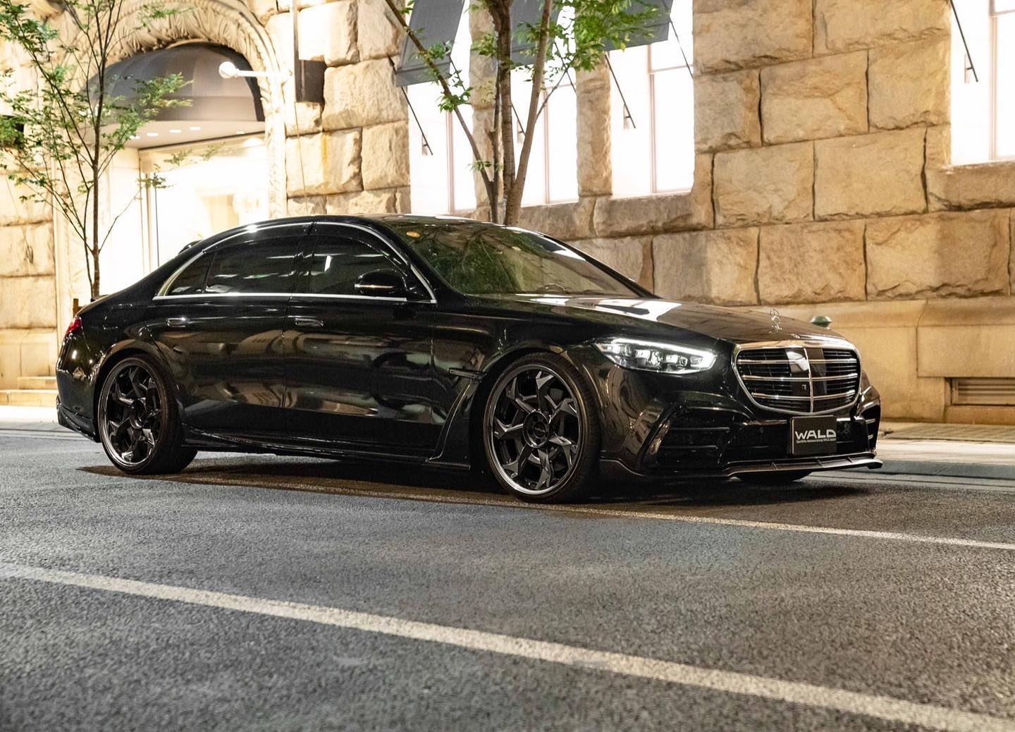 WALD International executive styling and wheels on a black Mercedes-Benz S-Class