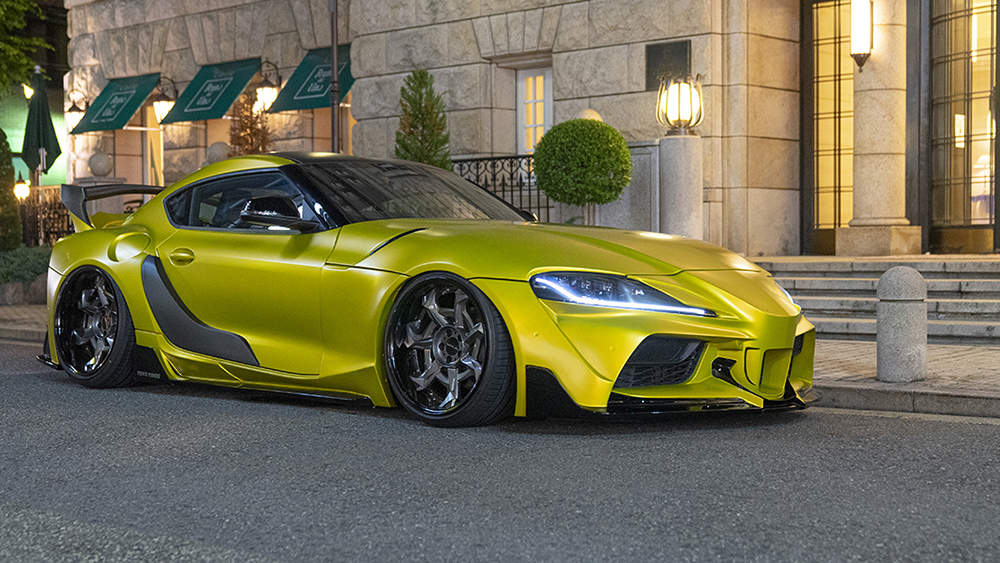 WALD International widebody styling on a yellow Toyota GR Supra