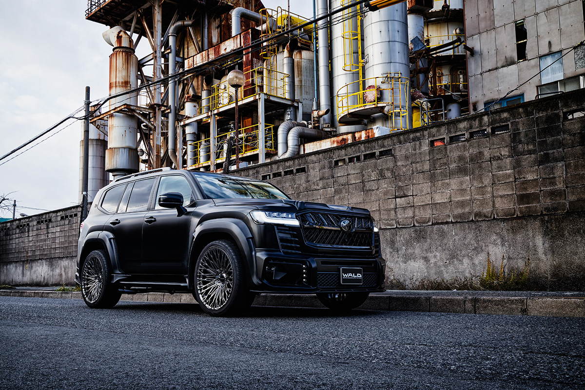 WALD International body styling and wheels on a black Toyota Land Cruiser 300