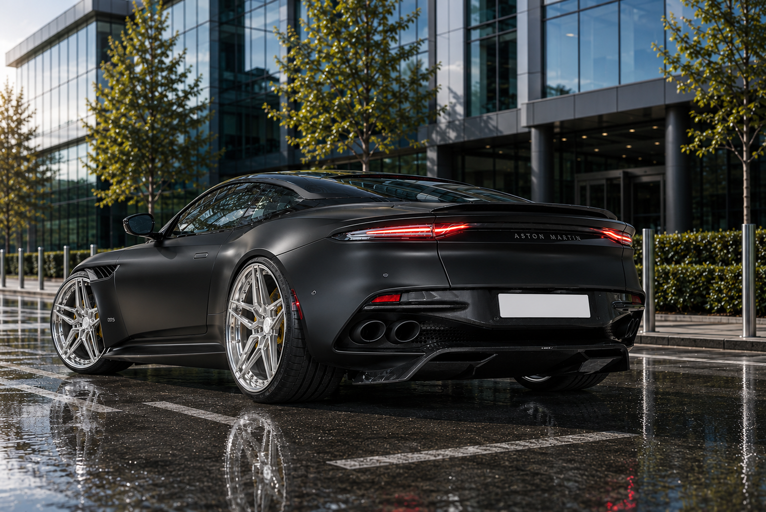 Satin black Aston Martin DBS on silver forged wheels with carbon fibre rear diffuser detailing