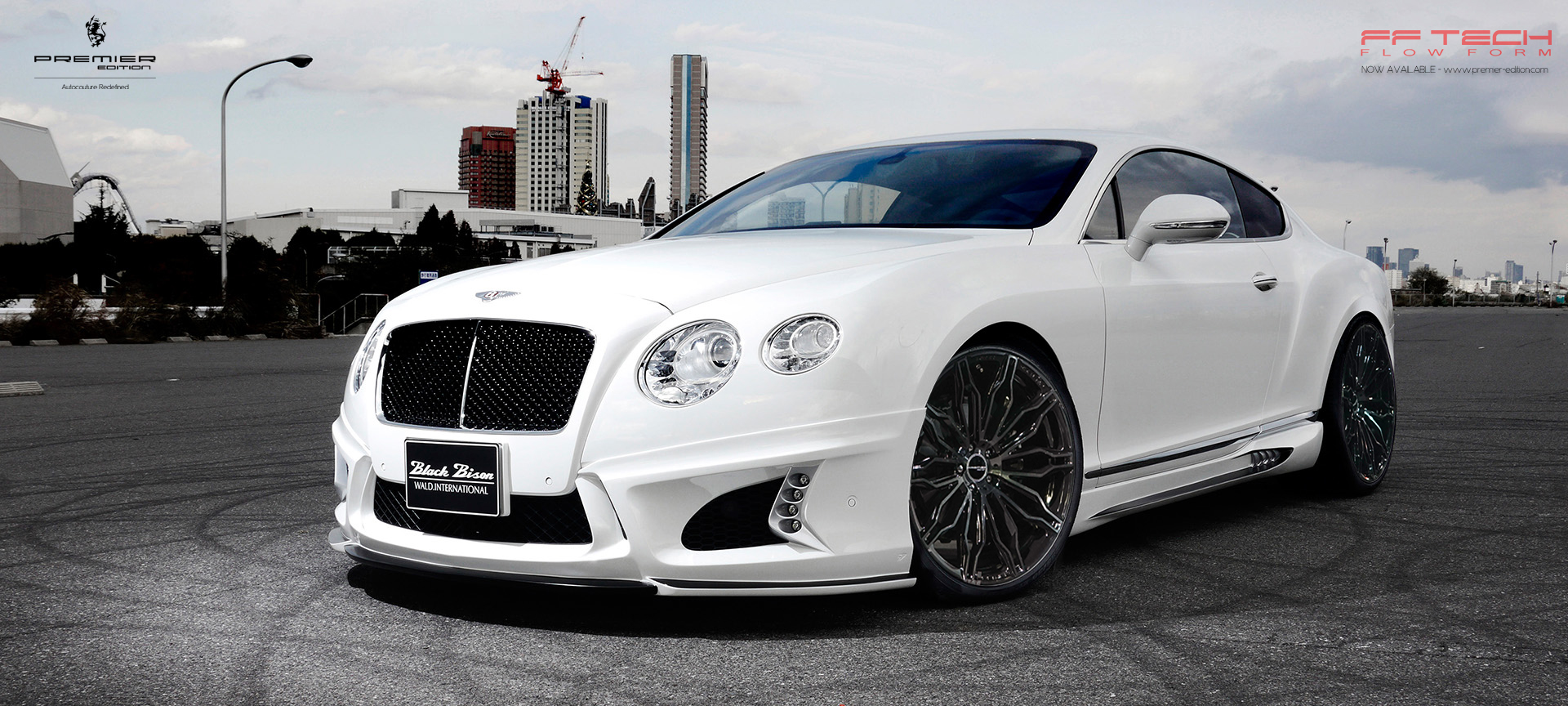 White Bentley Continental GT with a Wald International aerodynamic body kit and dark forged wheels
